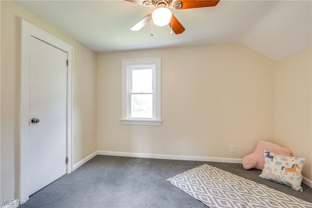 unfurnished bedroom featuring vaulted ceiling, ceiling fan, and carpet flooring