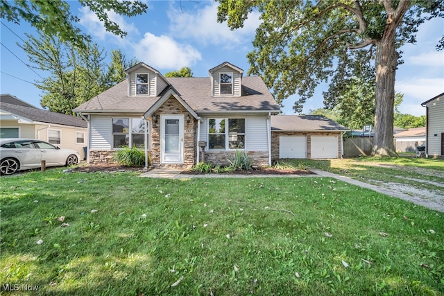 view of front of house featuring a garage and a front yard