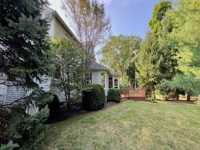 view of yard with a deck