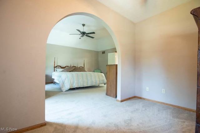 carpeted bedroom featuring ceiling fan and lofted ceiling