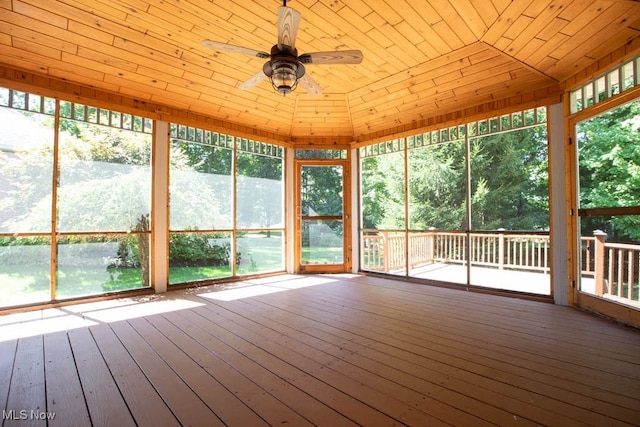 unfurnished sunroom featuring lofted ceiling, ceiling fan, and wood ceiling