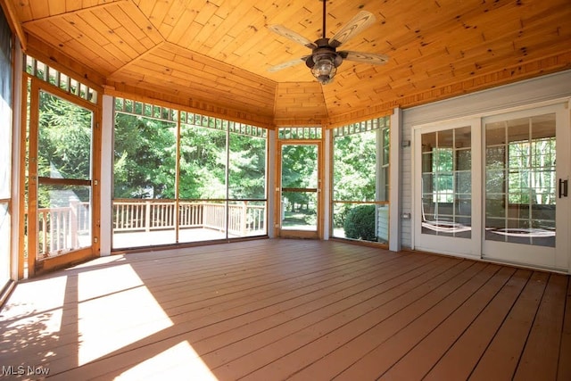 unfurnished sunroom with ceiling fan and wood ceiling