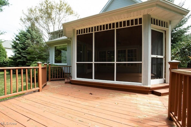 wooden terrace with a sunroom