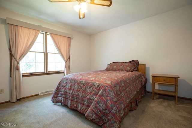 bedroom featuring ceiling fan and carpet floors