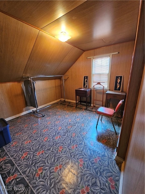 bonus room with wood walls, wooden ceiling, and vaulted ceiling