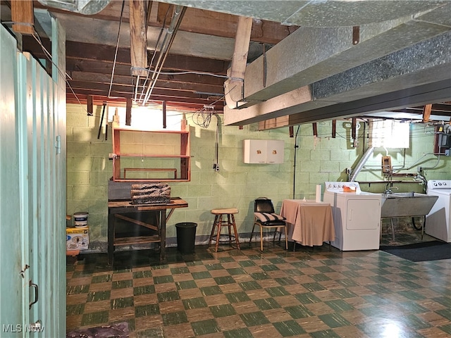 basement featuring sink and separate washer and dryer