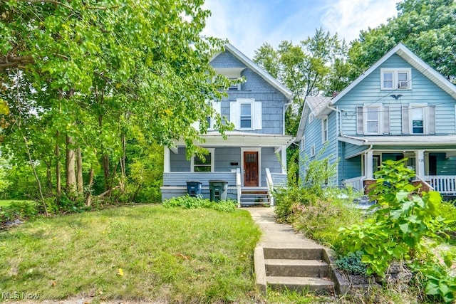 view of front of property with a front lawn and a porch