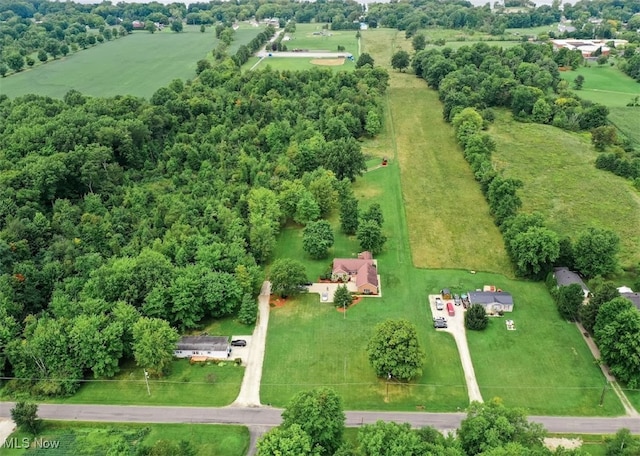 birds eye view of property with a rural view