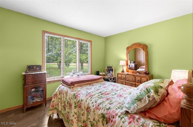 bedroom with hardwood / wood-style floors