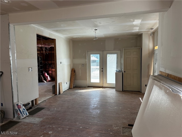 interior space featuring wood-type flooring and french doors