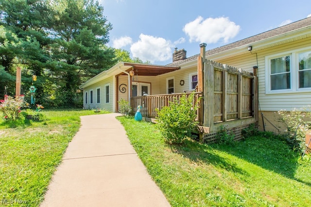 exterior space featuring a front lawn