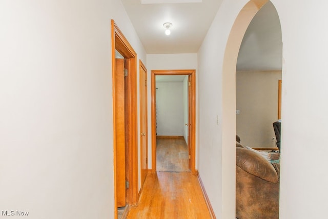 corridor with light wood-type flooring