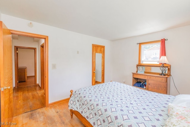 bedroom with light hardwood / wood-style flooring