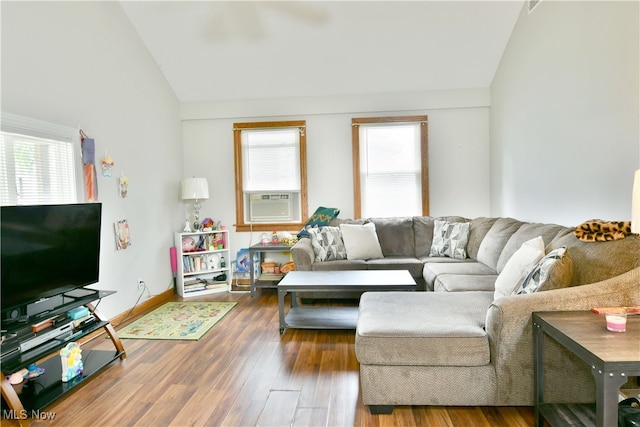 living room featuring lofted ceiling, plenty of natural light, and hardwood / wood-style floors