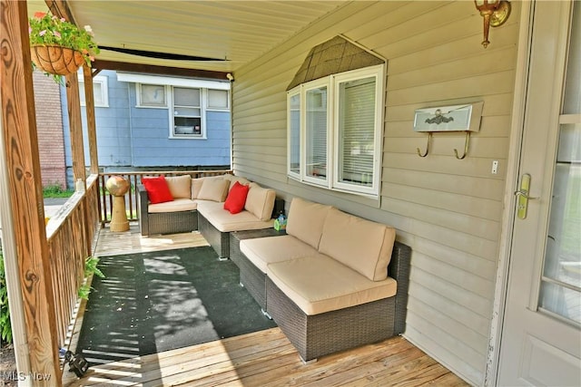 wooden terrace featuring an outdoor hangout area