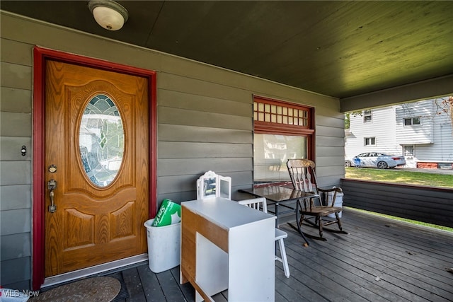 doorway to property featuring covered porch