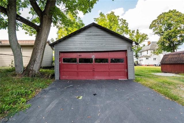 garage featuring a yard