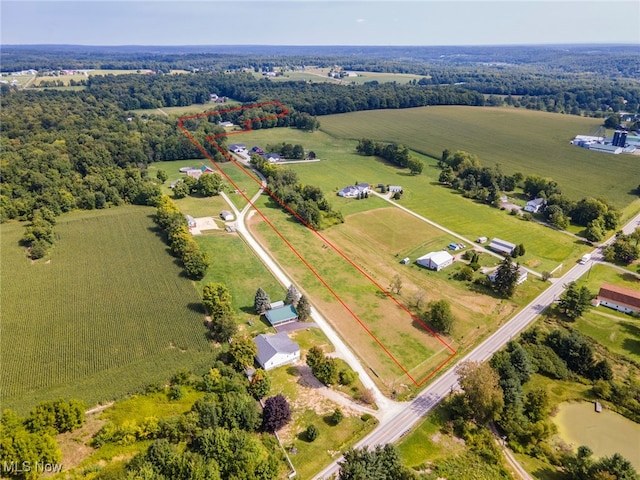 birds eye view of property with a rural view