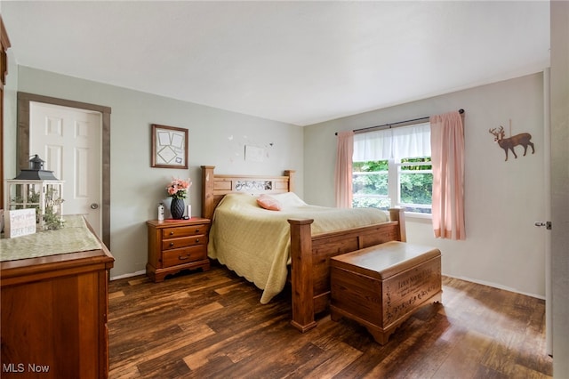 bedroom featuring dark wood-type flooring