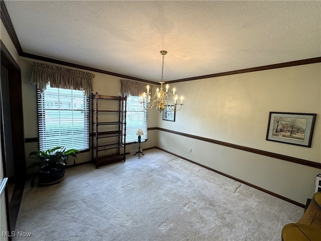 interior space featuring light carpet, crown molding, a textured ceiling, and a chandelier