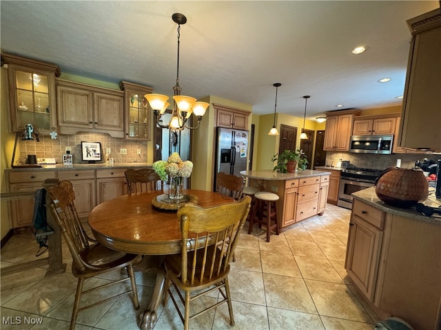 tiled dining area featuring an inviting chandelier