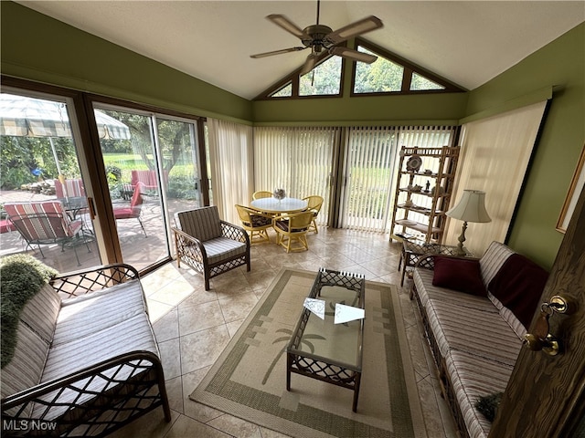 sunroom / solarium featuring lofted ceiling, plenty of natural light, and ceiling fan