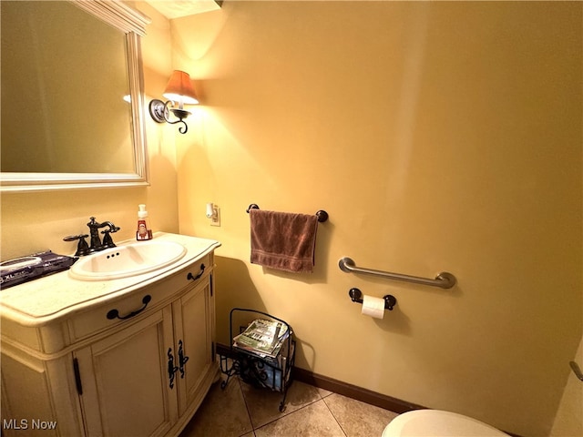 bathroom with tile patterned floors, toilet, and vanity