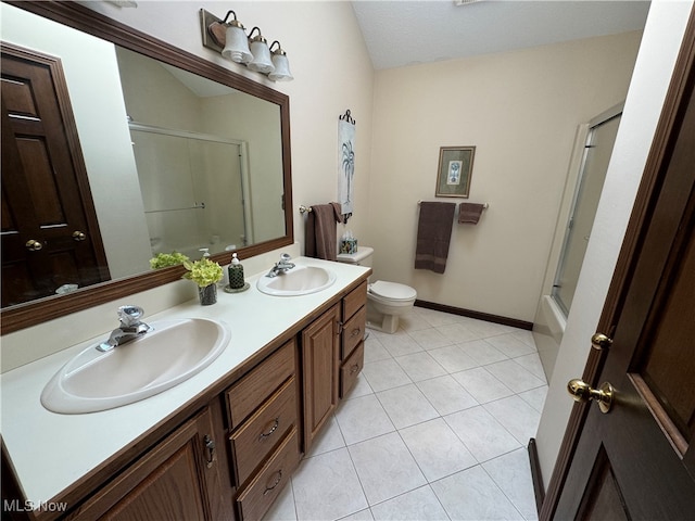 full bathroom with a textured ceiling, vanity, toilet, tile patterned floors, and enclosed tub / shower combo