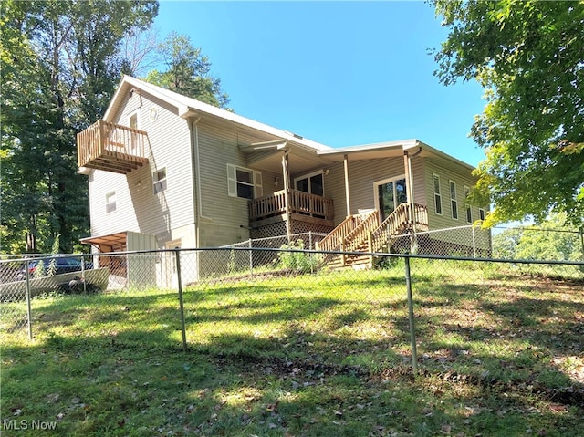 back of house featuring a yard