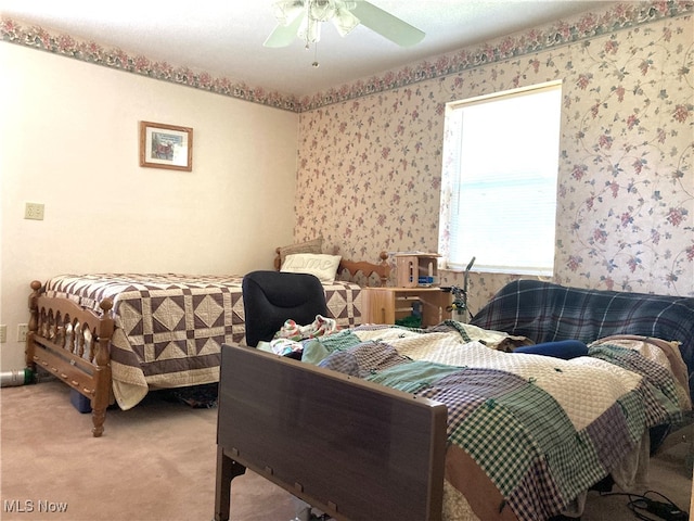 bedroom with ceiling fan and carpet floors