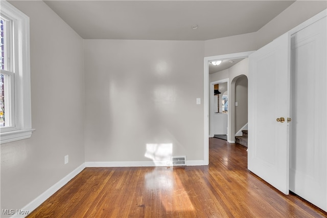 unfurnished room featuring hardwood / wood-style floors