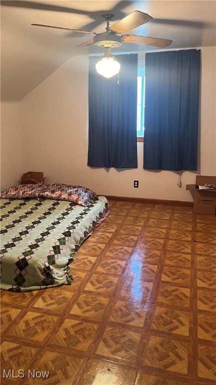 unfurnished bedroom featuring parquet floors and ceiling fan