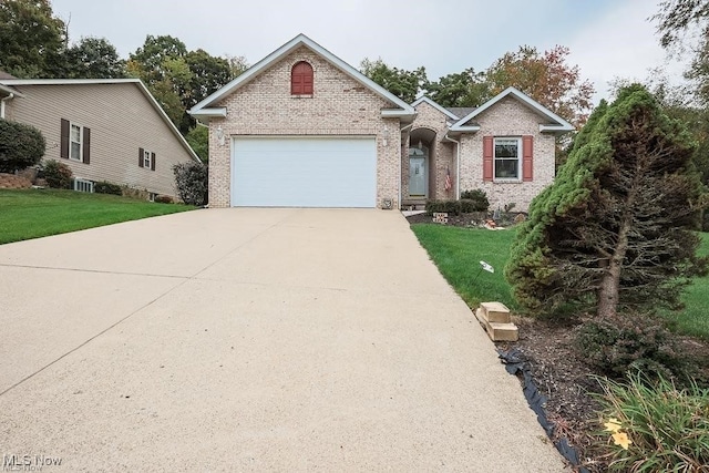 view of front of home featuring a garage and a front yard