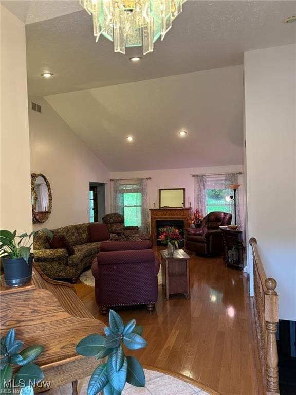 620 Bridgeview Ave, Chester, WV 26034 - living area featuring lofted ceiling, wood finished floors, a chandelier, recessed lighting, and a fireplace