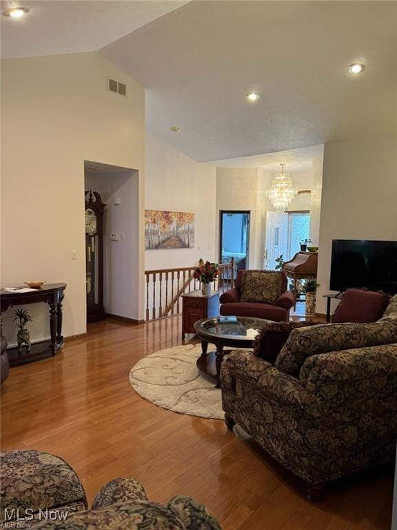 620 Bridgeview Ave, Chester, WV 26034 - living area with a chandelier, wood finished floors, and high vaulted ceiling