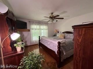 bedroom featuring dark wood-type flooring and ceiling fan