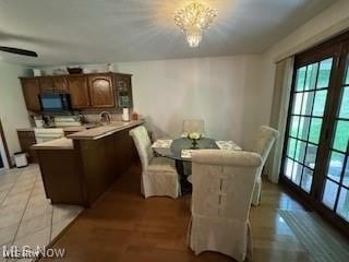 dining room featuring a chandelier and light hardwood / wood-style floors