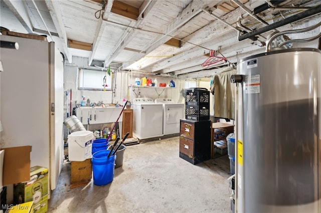 basement with washing machine and clothes dryer and water heater