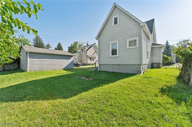 back of house with a lawn