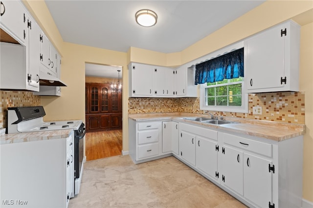 kitchen with sink, white electric stove, and white cabinets