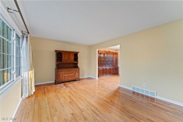 unfurnished living room featuring light wood-type flooring