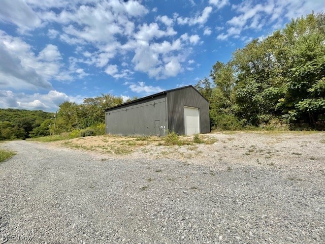 view of outbuilding with a garage