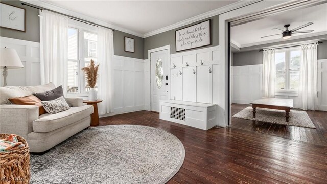 sitting room with ornamental molding, ceiling fan, and dark hardwood / wood-style floors