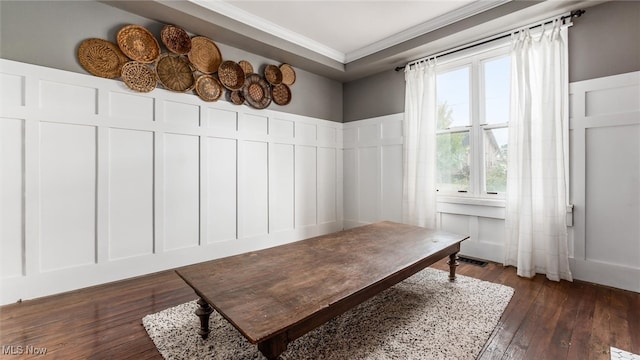 interior space with ornamental molding and dark hardwood / wood-style flooring