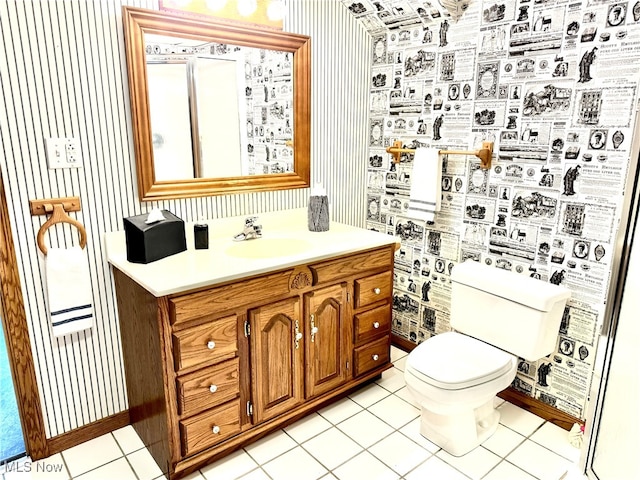 bathroom featuring tile patterned floors, vanity, and toilet