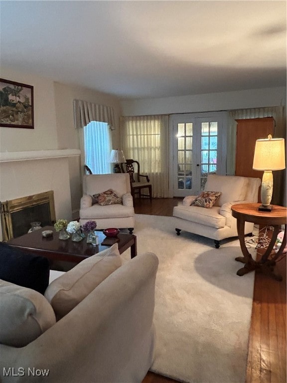 living room with a wealth of natural light and hardwood / wood-style floors