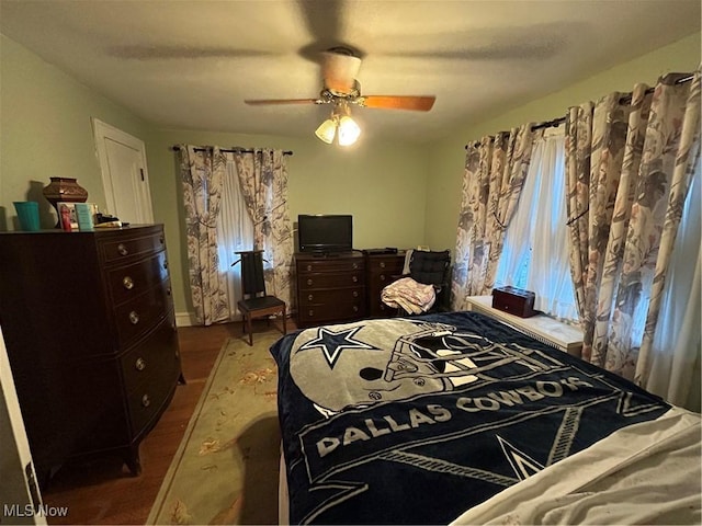 bedroom featuring ceiling fan and wood finished floors