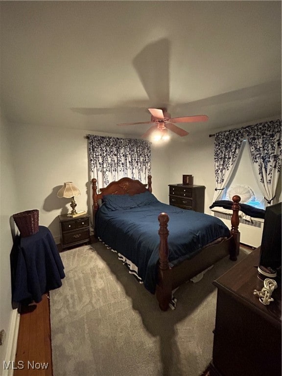 bedroom featuring wood-type flooring and ceiling fan