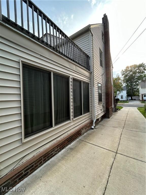 view of home's exterior featuring a balcony