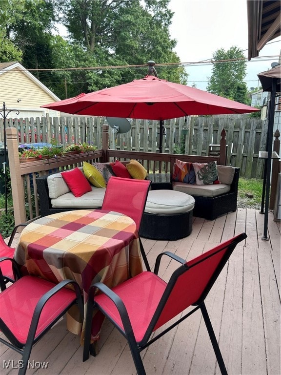 wooden deck featuring an outdoor hangout area